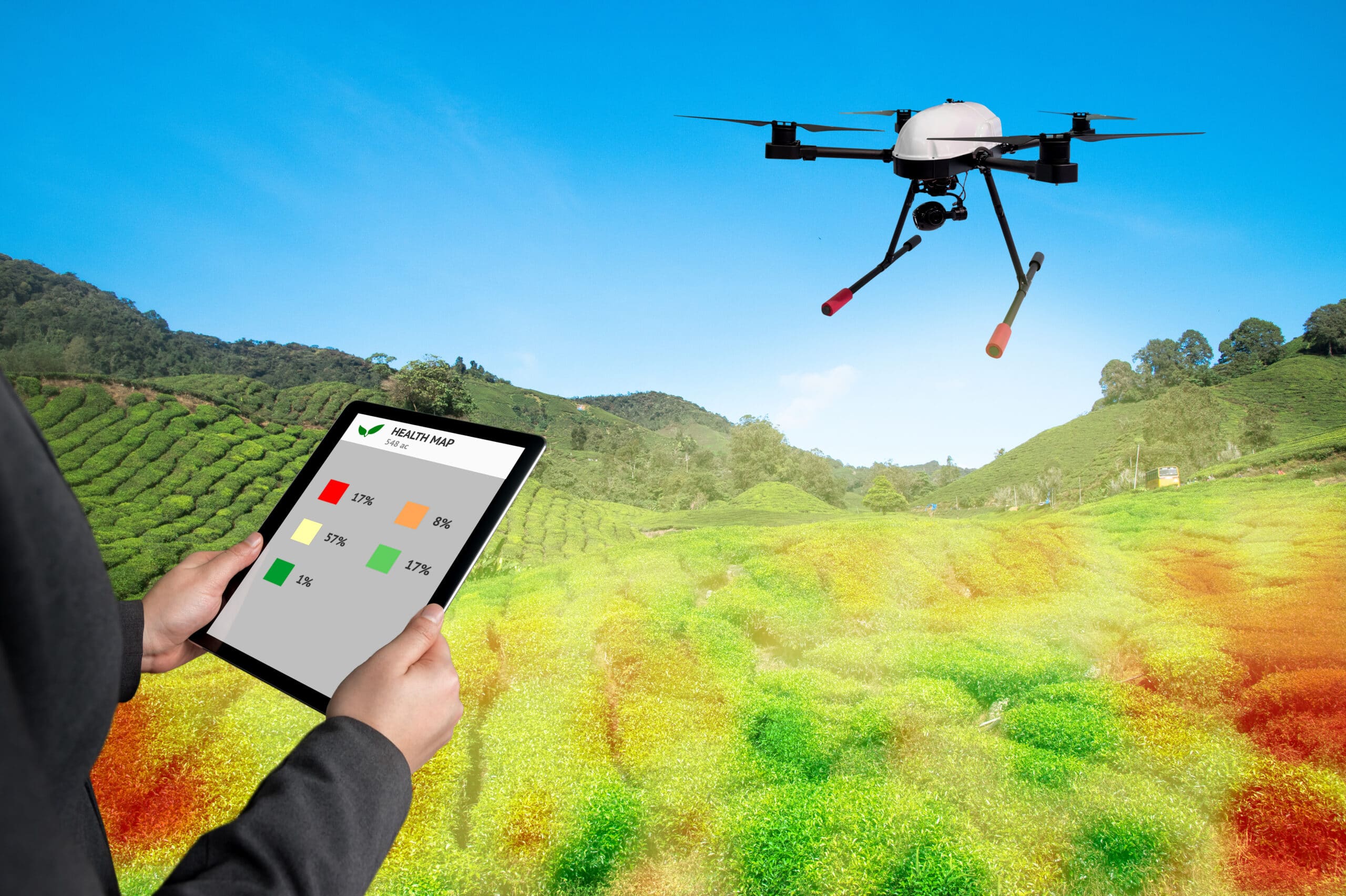 Four farmers in a lush field observing a drone spraying crops, using digital devices to analyze agricultural data.